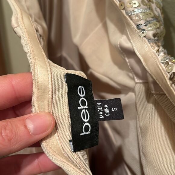 Bebe strapless fringe and sequin dress. Top is gold and the fringe is light pink - Picture 10 of 11